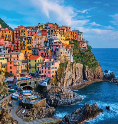 Colorful houses on a cliff overlooking the sea.